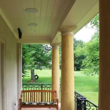 Venetian plaster columns and porch swing
